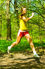 young woman running in park