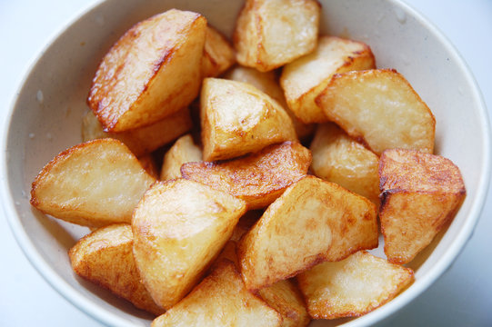 close up of fried potato with white as background