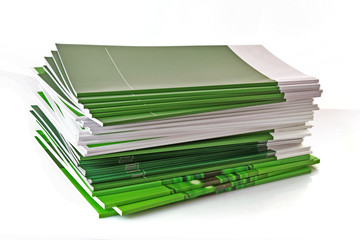 Pile of color magazines isolated on white background