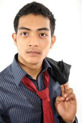 A portrait of a confident and handsome young Asian man wearing formal office attire and a tie, standing against a clean white background. Perfect for business, corporate, professional lifestyle, HR, o
