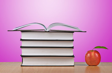 Red apple and open book