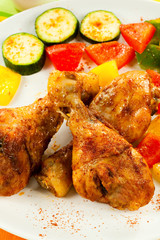 Roasted chicken drumsticks and vegetables