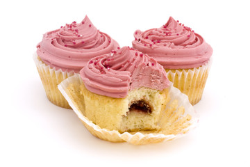 three pink cupcakes