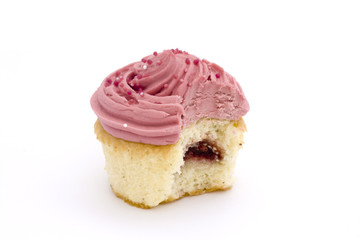 pink cupcake with bite taken