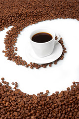 Cup with coffee, costing on coffee grain