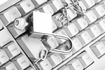 Computer  keyboard secured with chain and padlock..