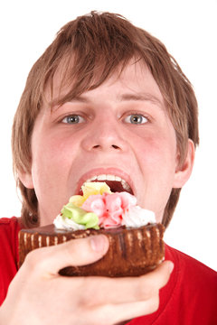 Young Man Eating Chocolate Cake.