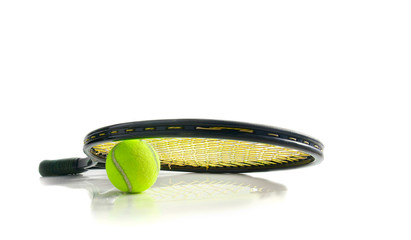 Tennis racket and ball on white surface