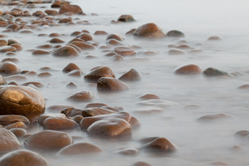 Fototapeta na wymiar Stone coast near the sea