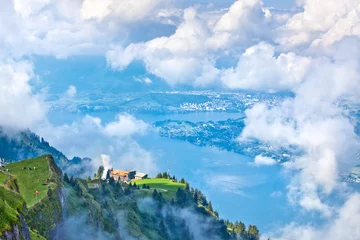 Poster Swiss landscape through clouds © chaossart