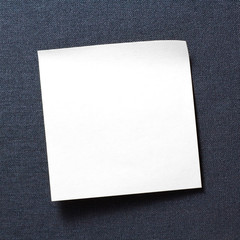 A blank white memo on grey texture