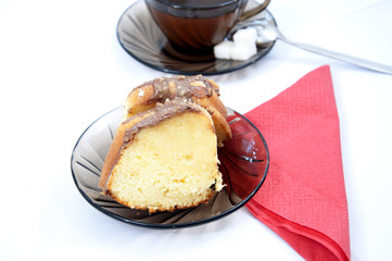 Marble cake on plate with tea