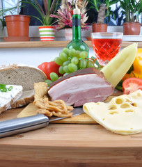 Meal concept with bread, onion, tomatoes, cheese, wine, bacon - 23020858