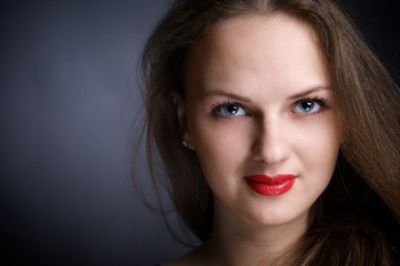 Portrait of beautiful young woman with big eyes