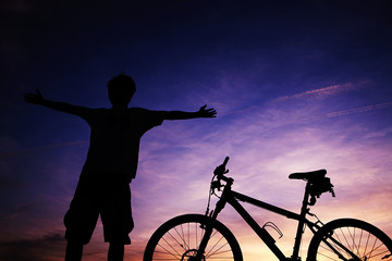 young asian man with bike