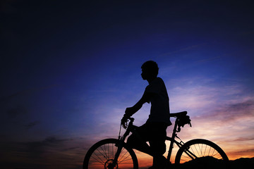 young asian man with bike