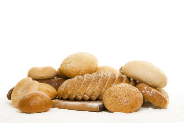 bread on a wooden board sprinkled with flour