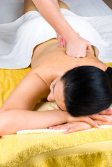 Obraz na płótnie Canvas Woman receiving deep back massage at spa