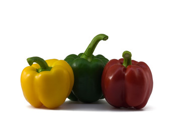 Three multi-coloured pepper: green, red, yellow