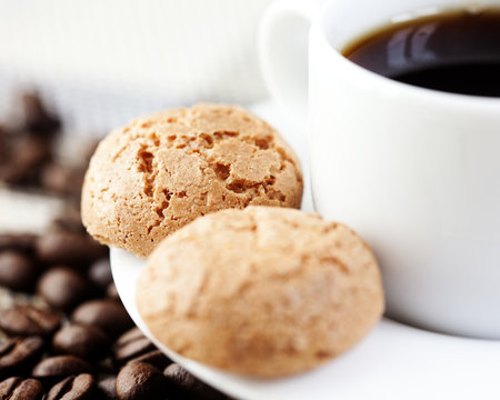 Closeup of biscotti and a cup of coffee