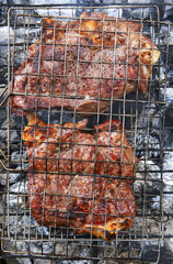 cooked beef steak on charcoal