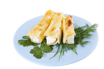 cheese cannelloni on blue plate
