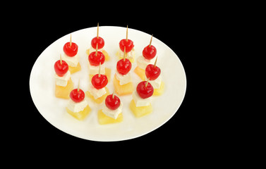 Cherry topping on pineapple and cottage cheese at shallow DOF