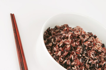 dark mixed rice in white bowl