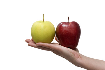 a yellow and a red apple in the hand