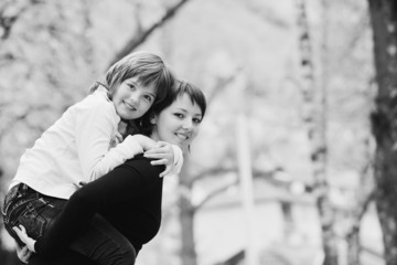 Fototapeta premium happy girl and mom outdoor