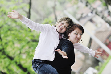 Fototapeta premium happy girl and mom outdoor