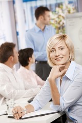 Businesswoman making notes on meeting