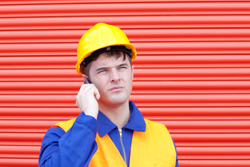 Attractive male engineer talking on the phone