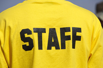 staff person with bright yellow shirt