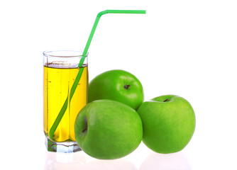 Glass of apple juice with green apples