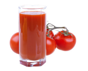Glass of fresh tomato juice with tomatoes