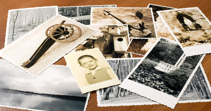 Pictures with ornamented edges on table