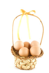 Fototapeta na wymiar Chicken eggs in the basket