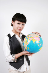 businesswoman holding a globe on white background