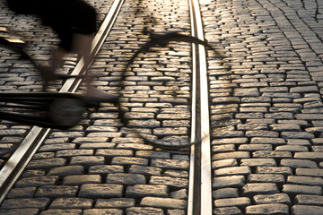 Tram tracks in Ghent with cyclist, Belgium