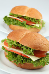 Ham and cheese sandwiches with tomatoes and lettuce