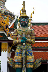 Fototapeta premium Green ogre statue with door