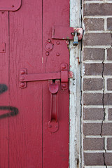 Old Red wooden door in old building