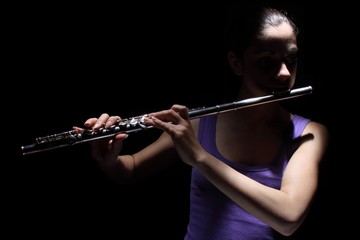 Girl playing a flute © Karlowac