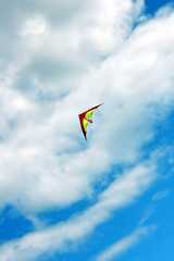 Fototapeta na wymiar kite flying in midair, blue sky, cloudscape