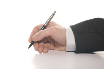 businessman's hand signing an important document
