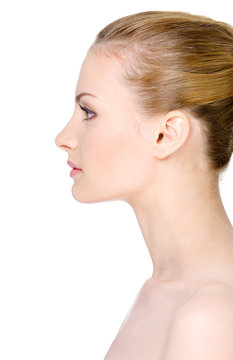 Clean woman's face in profile on a white