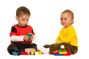 Playing with blocks two toddlers