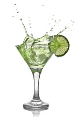 Green alcohol cocktail with splash and green lime