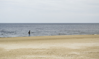 Fototapeta na wymiar Man on the beach.